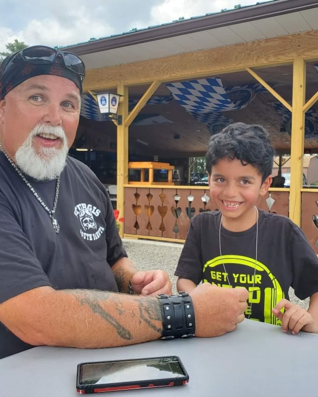 Veteran volunteer with a young visitor